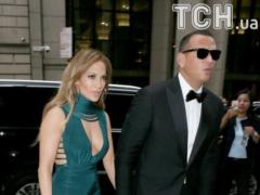 A secular way out with a boyfriend: Lopez in a dress with an open neckline came to the wedding of a football player