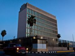 Cubans  crouched  Americans in their ears