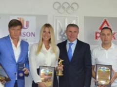 Харлан получила эксклюзивную награду за рекордное признание от НОК