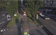 In Kiev, an activist Femen climbed onto the pedestal of the monument to Lenin