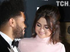 Selena Gomez and The Weeknd cute kisses and hugs in front of photographers at a party