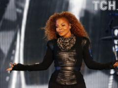 Paparazzi caught a noticeably thinner Janet Jackson during a walk with a grown-up son