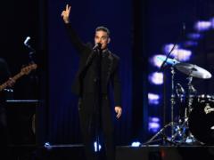 Robbie Williams posed as another celebrity for the sake of sex with a journalist