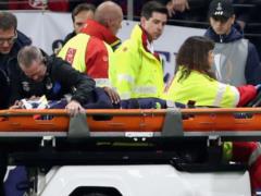 Everton s defender injured his neck and was taken to the hospital
