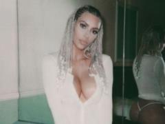 Playful Kim Kardashian with afrokosami showed naked breasts and buttocks in thongs