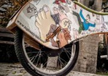 A wooden electric bike with auto-balance is presented