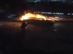 On the Moskva River, a ship is burning