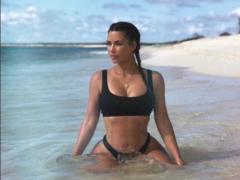 Tanned Kim Kardashian in mini-bikini published photos from the rest
