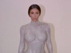 Completely naked Kim Kardashian lay on the table