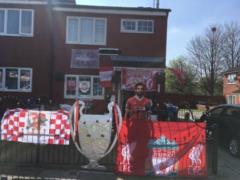 Cup and Salah almost full-length. The fan made from her house the shrine of Liverpool to the Champions League final