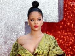 Rihanna in a dress-foil almost bare her breast