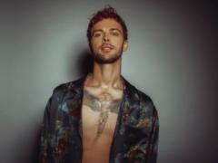 Max Barskikh with an angel on his chest section of girls in a teaser of a new clip