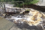 The workers told when they would finish repairing the washed road in Kirovgrad