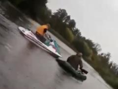 Near Kiev drunk on a water scooter stoked fisherman boats