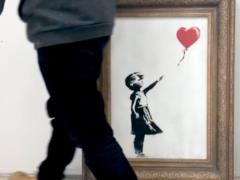 Banksy complained of a broken shredder in the movie  The Girl with the Ball 