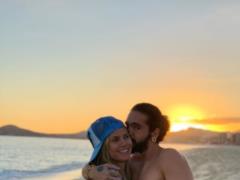 Heidi Klum published a beach photo in which a nude young boyfriend hugs her