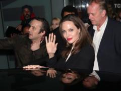 Luxurious Angelina Jolie in a monochrome outfit attended a social event