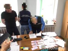 Полиция поймала на взятках чиновников ГИС и ГФС на Харьковщине