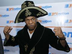 Warm up before returning to the ring: Mike Tyson has a fight with a ferocious predator