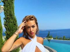 Tanned Ora topless swim in the pool