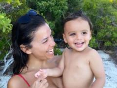 Unpainted Eva Longoria in a swimsuit posed playfully with her two-year-old son