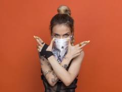 Daring MamaRika in a scarf has released a hit about  