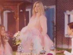 Irina Bilyk in a pink dress showed her first love in a new video