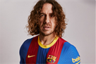 Puyol unveils new Barcelona kit for the match with Real