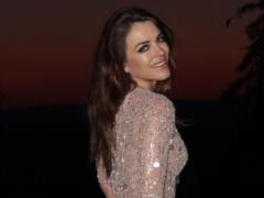 Elizabeth Hurley fully nude in a haystack