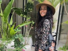 Playful Nastya Kamenskikh in a mini dress bared her long legs