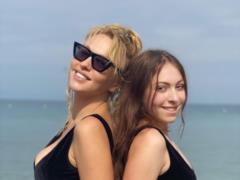 Olya Polyakova with her daughter in identical swimsuits measured their figures