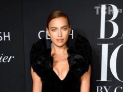 Sexy Irina Shayk in a tight dress with a neckline stuck out her elastic breasts