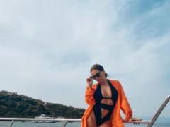 Ani Lorak with a multi-colored bikini emphasized a lush bust and a flat stomach
