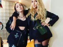 Olya Polyakova zaheyli for a photo of her daughter with a gun
