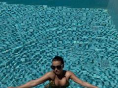 Ani Lorak in a bikini boasted a lush bust and a tanned pumped tummy