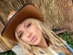 Lesya Nikityuk with pink hair in a leather jacket surprised with a new way