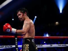 Boxing legend s gloves were sold at auction: the funds were transferred to the wife of a Ukrainian coach killed by the occupiers