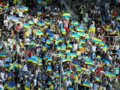 Fans at the Ukraine-Armenia match portrayed Putin in a condom