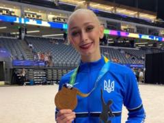 The 18-year-old gymnast won the first World Games medal for Ukraine in 9 years and dedicated the victory to her father, who serv