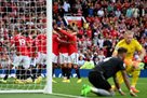 Rashford s three scores and Anthony s debut goal stole Arsenal s top spot