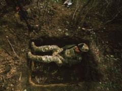In a trench and with a machine gun:  