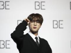 30-year-old member of the BTS team, having shaved his thick hair and served to the army