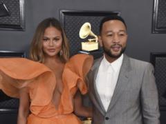 Chrissy Teigen and John Legend show their newborn daughter for the first time