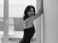 Masha Efrosinina in a dress with a revealing neckline enchanted with a feminine photo shoot
