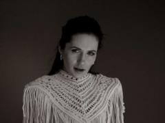 Natalka Denisenko covered her naked bust with her hands in a feminine photo shoot