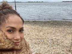 Jennifer Lopez in a stylish fur coat enjoyed coffee on the beach and hinted at a new song