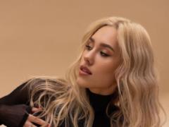 Dasha Kvitkova in a seductive bodysuit boasted slender legs