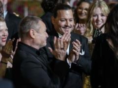 Johnny Depp bursts into tears as he received seven minutes of applause at the Cannes Film Festival