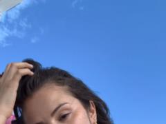 Selena Gomez at the pink swimsuit lit up a bust of a bust on a yacht