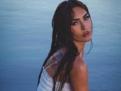 Wet Megan Fox in a mini dress enchanted with a seductive photo shoot on the beach